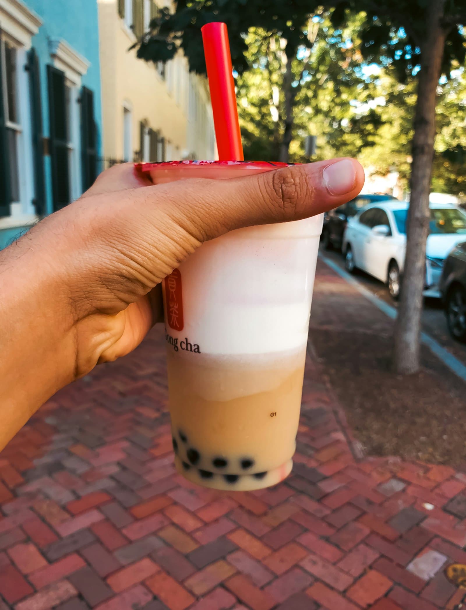 Hand holding a bubble tea drink