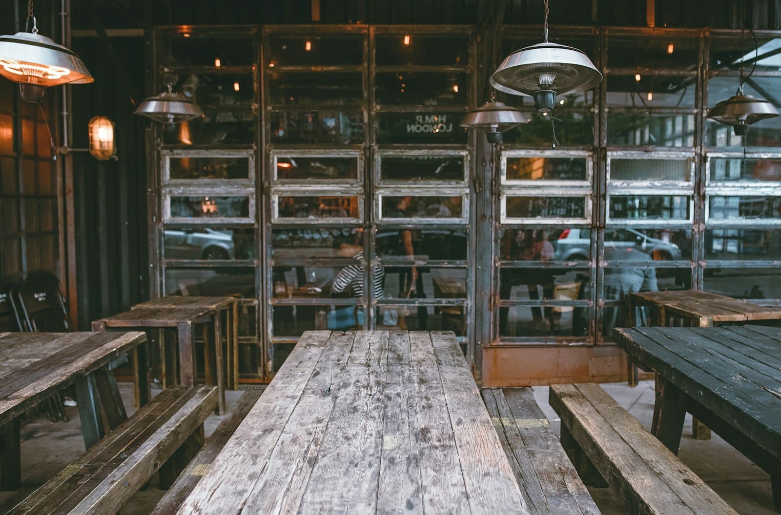 Full-service restaurant dining room with tables set for service