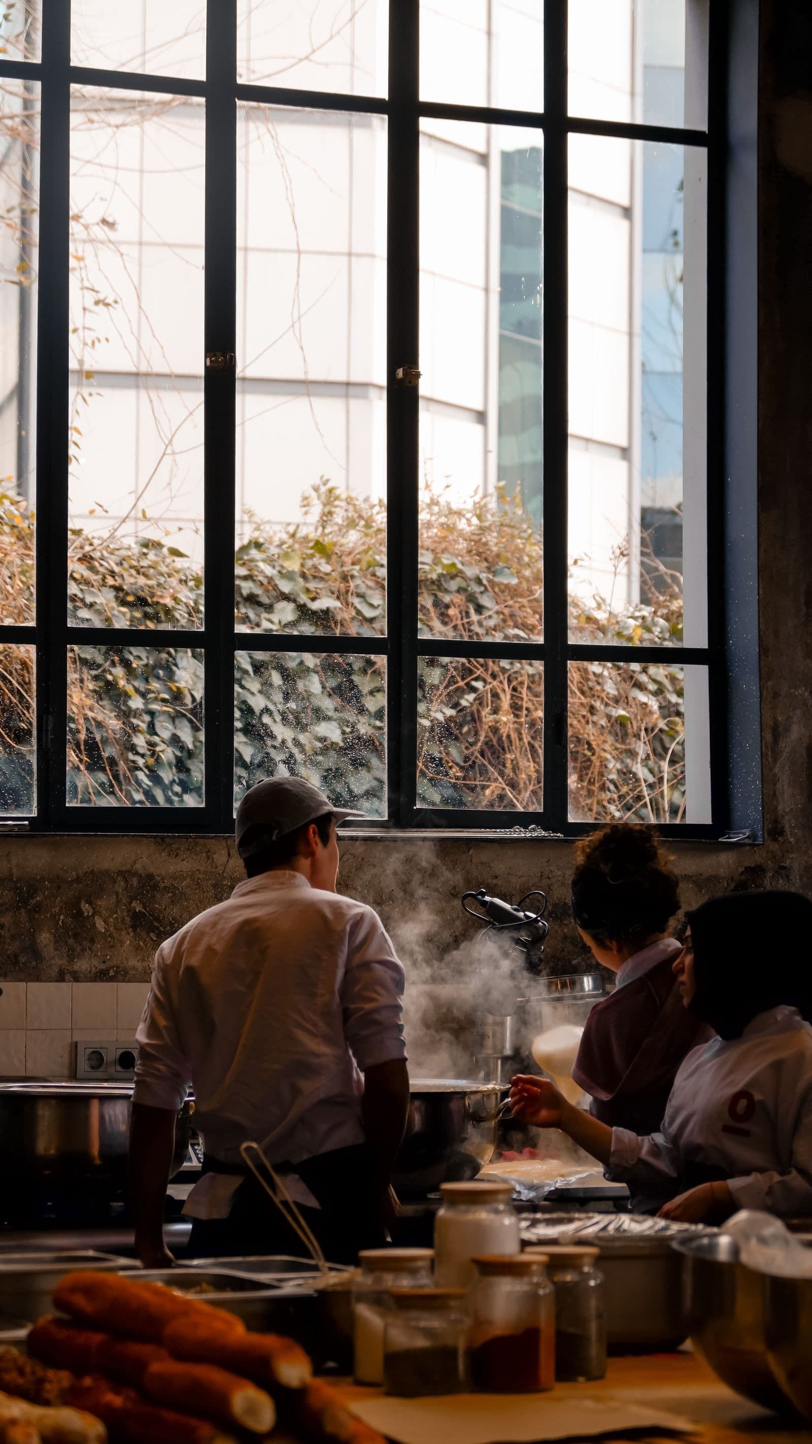 Restaurant kitchen team working at prep stations
